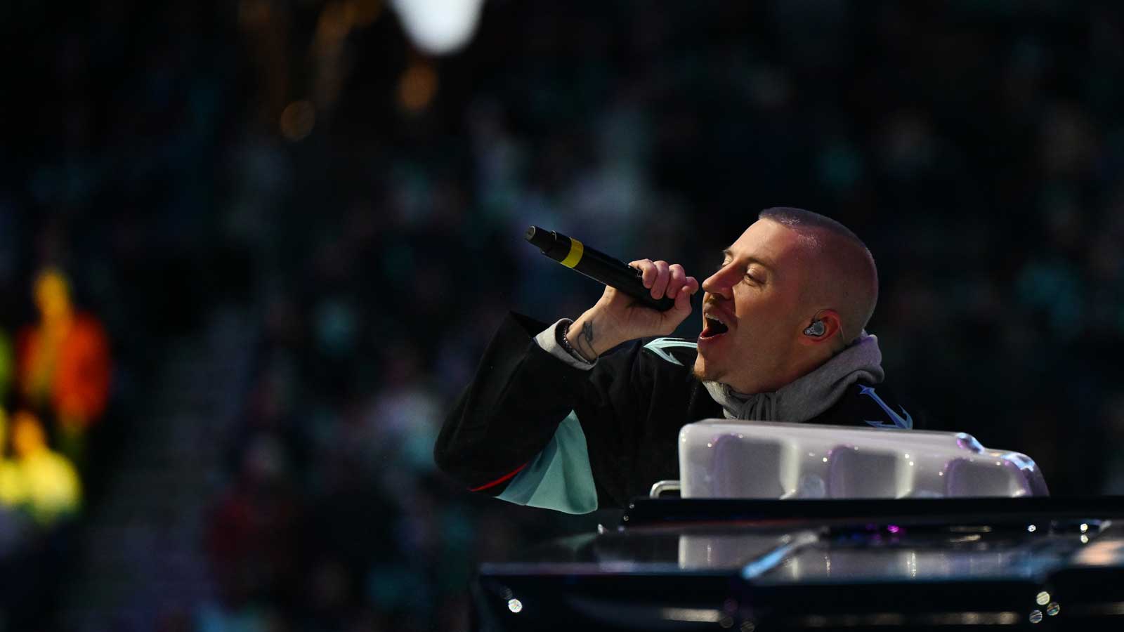 Ed Sheeran's former Loop Tour opener Macklemore performing.