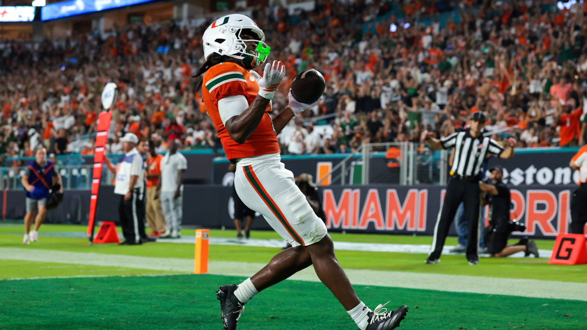 Miami Hurricanes wide receiver Malachi Toney (1) scores a touchdown in the second quarter against the Florida A&M Rattlers at Hard Rock Stadium. 