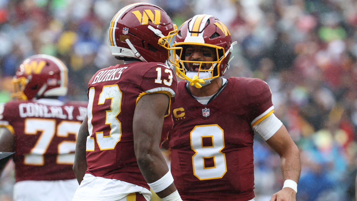 https://wp.clutchpoints.com/wp-content/uploads/2026/09/Marcus-Mariota-and-Trey-Burks-celebrating-a-Commanders-touchdown.jpg
