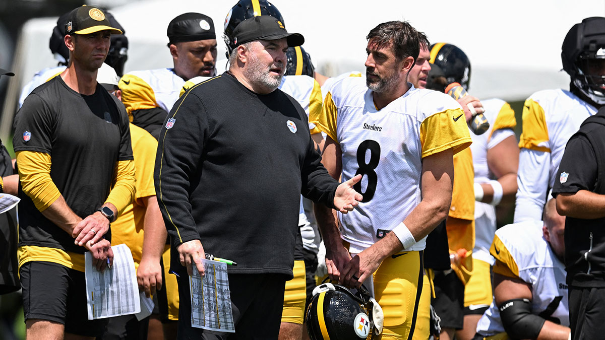 Pittsburgh Steelers head coach Mike McCarthy talks with quarterback Aaron Rodgers (8) during a practice session at Training camp at Saint Vincent College.
