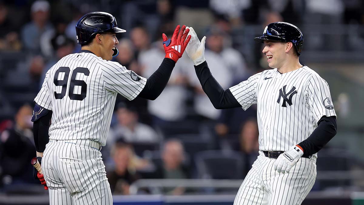 Sep 23, 2026; Bronx, New York, USA; New York Yankees designated hitter Ben Rice (22) celebrates his solo home run against the Tampa Bay Rays with shortstop George Lombard Jr.