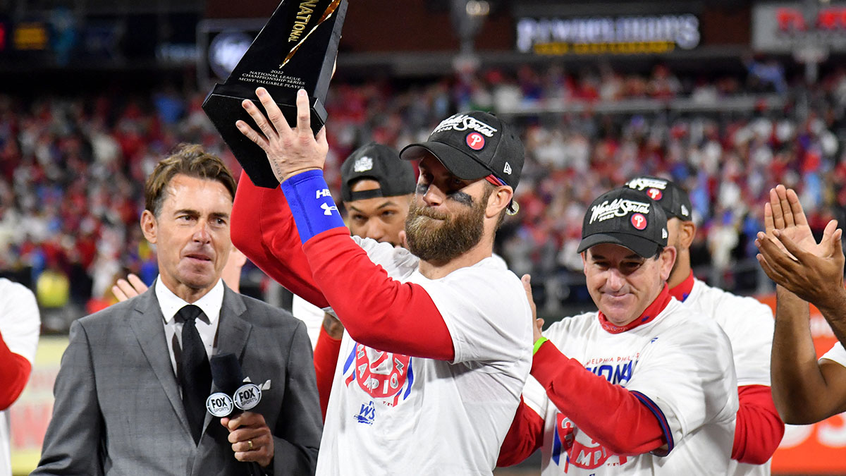 Philadelphia Phillies designated hitter Bryce Harper hold the MVP trophy after their 4-3 win over he San Diego Padres to win the National League Pennant in game five of the NLCS for the 2022 MLB Playoffs at Citizens Bank ParkMandatory Credit: Eric Hartline-Imagn Images