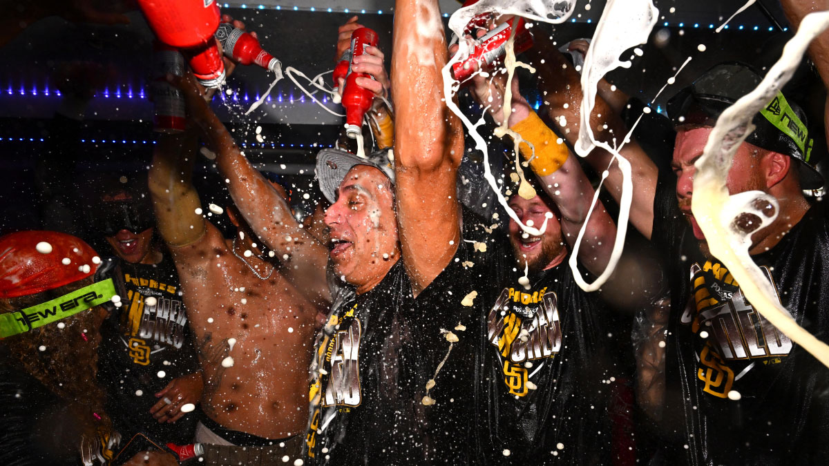 San Diego Padres owner Jose E. Feliciano celebrates with the team after securing a playoff spot at Dodger Stadium.