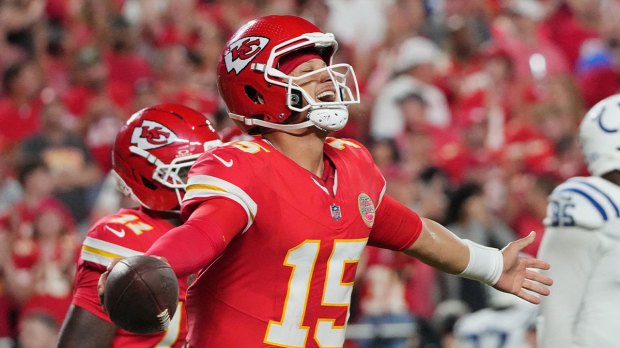 Kansas City Chiefs quarterback Patrick Mahomes (15) celebrates after a touchdown against the Indianapolis Colts during the third quarter at GEHA Field at Arrowhead Stadium.
