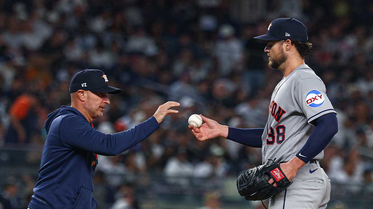 https://wp.clutchpoints.com/wp-content/uploads/2026/09/Peter-Lambert-hands-the-ball-to-Joe-Espada.jpg