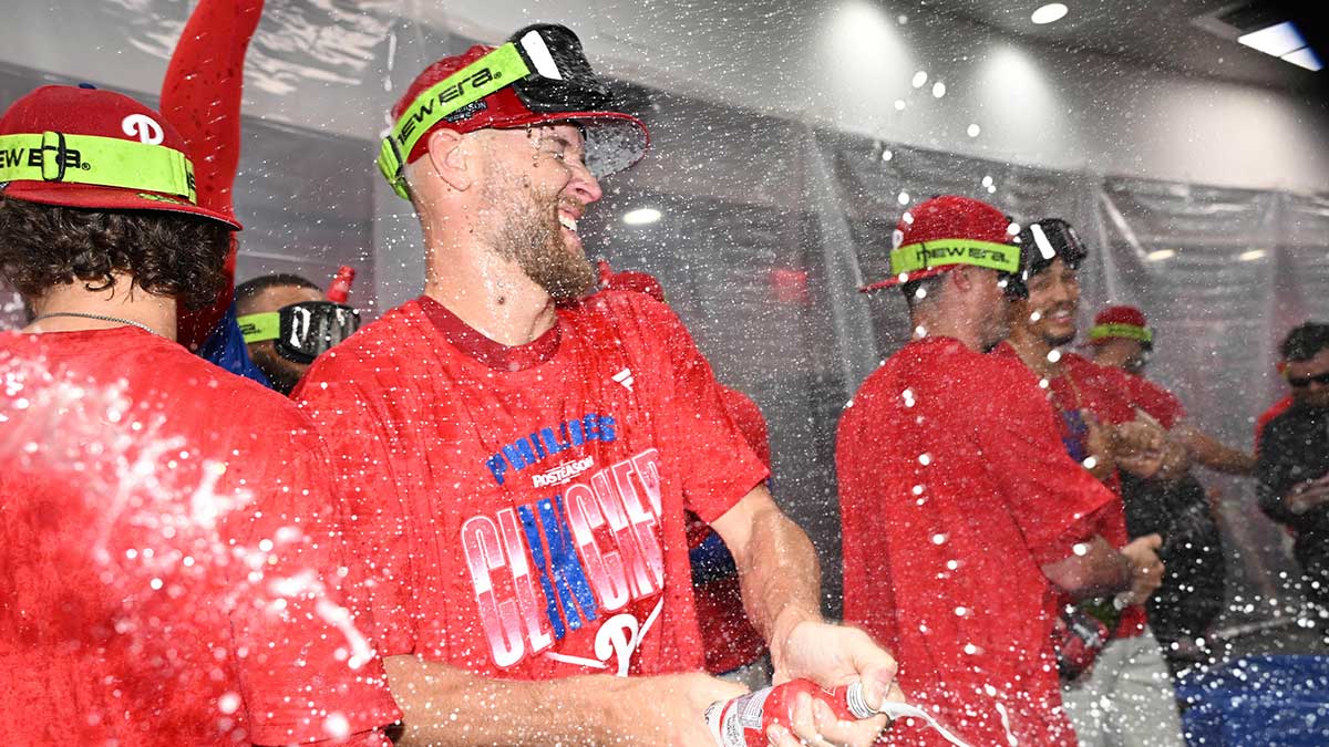 Philadelphia Phillies pitcher Zack Wheeler (45) celebrates in the locker room after win against the Tampa Bay Rays and clinching a playoff spot at Citizens Bank Park.