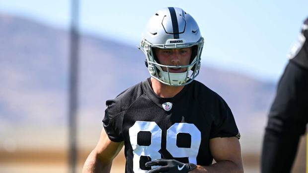 Las Vegas Raiders tight end Brock Bowers (89) warms up during organized team activities at Intermountain Health Performance Center.