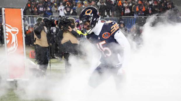 Chicago Bears wide receiver Rome Odunze (15) runs onto the field during player introductions before an NFC Divisional Round game against the Los Angeles Rams at Soldier Field.