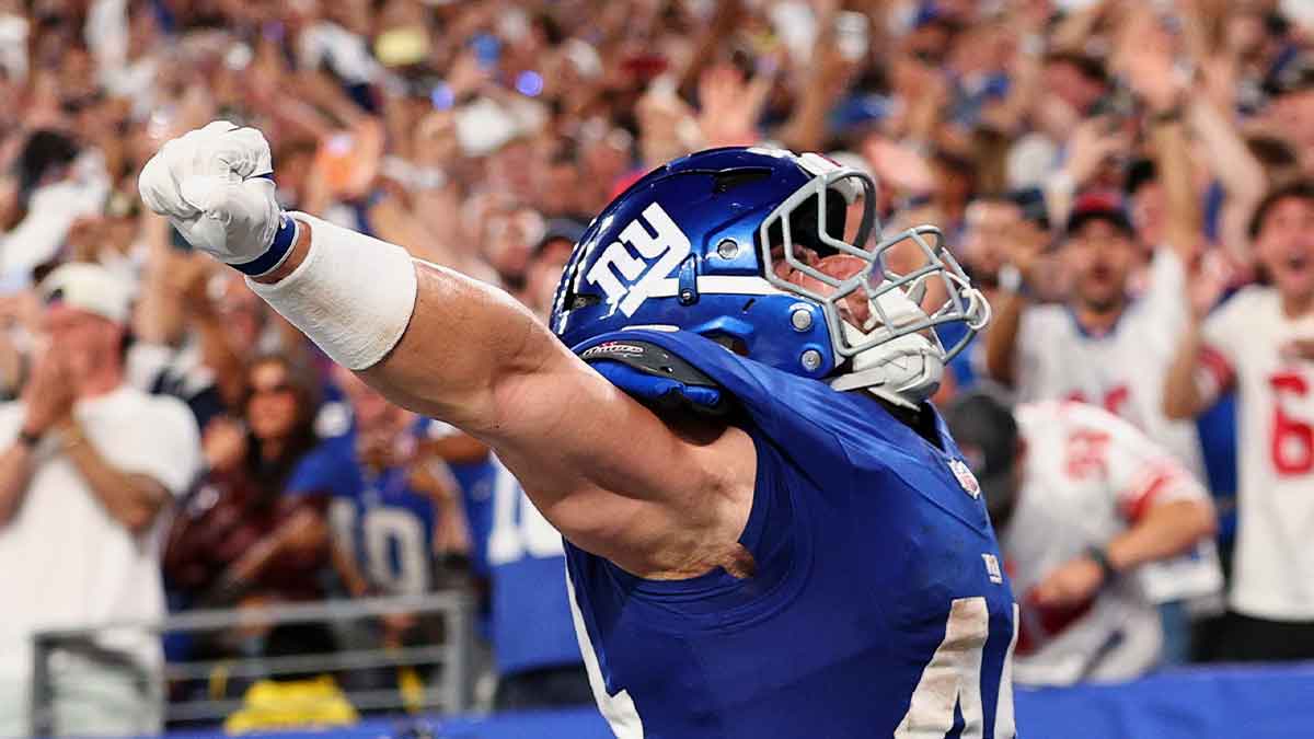 New York Giants running back Cam Skattebo (44) celebrates after scoring a touchdown against the Dallas Cowboys during the first quarter at MetLife Stadium.