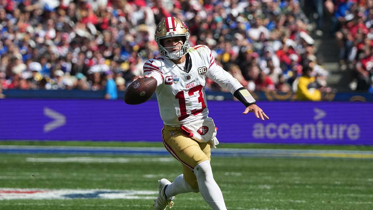 San Francisco 49ers quarterback Brock Purdy (13) runs with the ball in the second half against the Los Angeles Rams during the 2026 NFL Melbourne Game at Melbourne Cricket Ground.
