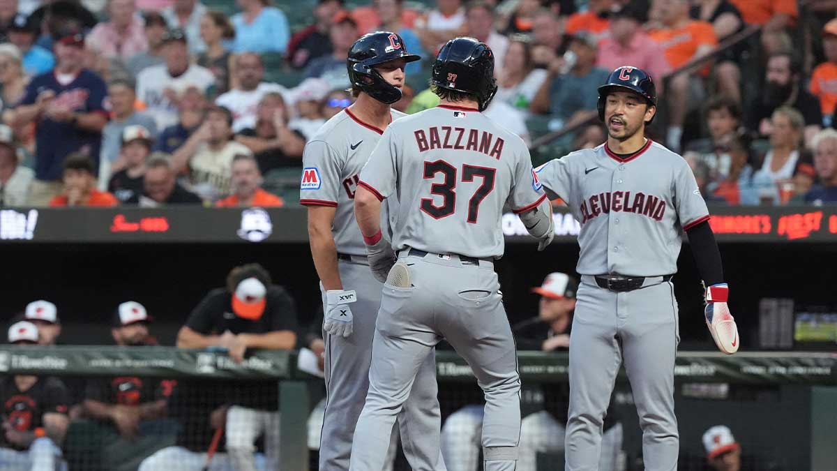 Cleveland Guardians left fielder Steven Kwan (38) congratulates Cleveland Guardians second baseman Travis Bazzana (37) for hitting a three run home run against the Baltimore Orioles during the second inning at Oriole Park at Camden Yards.