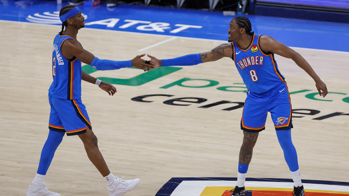 Oklahoma City Thunder guard/forward Jalen Williams (8) celebrates with guard Shai Gilgeous-Alexander (2) after he scored against the San Antonio Spurs during the second half at Paycom Center.