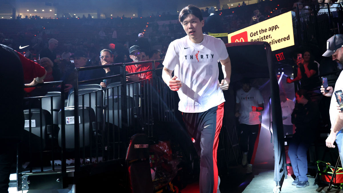 Portland Trail Blazers center Yang Hansen (16) enters Moda Center to play against the LA Clippers. 