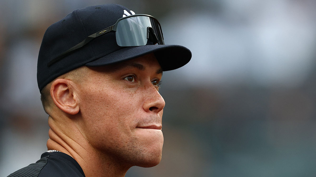 https://wp.clutchpoints.com/wp-content/uploads/2026/09/Yankees-outfielder-Aaron-Judge-99-looks-on.jpg