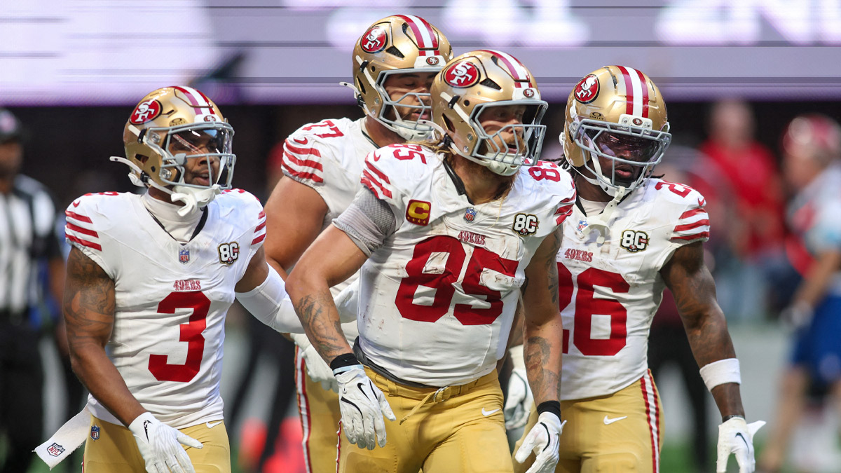 San Francisco 49ers tight end George Kittle (85) reacts with teammates after a catch against the Atlanta Falcons during the fourth quarter at Mercedes-Benz Stadium.