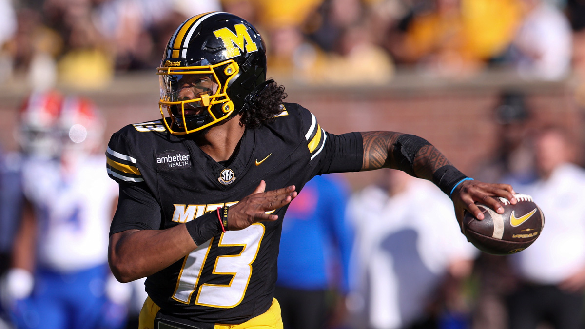 Missouri Tigers quarterback Austin Simmons (13) looks to throw in the third quarter against the Florida Gators at Faurot Field at Memorial Stadium.