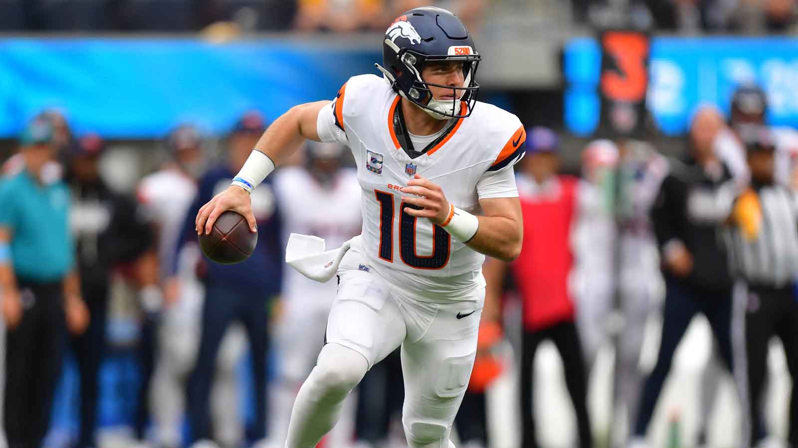 Denver Broncos quarterback Bo Nix (10) surveys the field against the Los Angeles Chargers during the first half at SoFi Stadium.