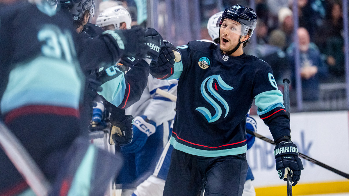 Seattle Kraken defenseman Brandon Montour (62) celebrates a goal with teammates on the bench during the third period against the Toronto Maple Leafs at Climate Pledge Arena.
