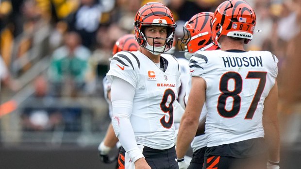 Cincinnati Bengals quarterback Joe Burrow (9) returns to the bench after being sacked on third down in the fourth quarter of the NFL Week 3 game between the Pittsburgh Steelers and the Cincinnati Bengals at Acrisure Stadium in Pittsburgh on Sunday, Sept. 27, 2026. The Bengals fell to 2-1 on the season with a 30-27 loss on the road.