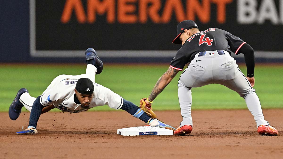 Tampa Bay Rays outfielder Chandler Simpson (14) steals second base against Cleveland Guardians shortstop Brayan Rocchio (4) during the second inning in game six of the ALCS for the 2026 MLB Playoffs at Tropicana Field.