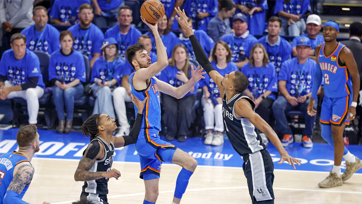 Oklahoma City Thunder center Chet Holmgren (7) shoots against San Antonio Spurs forward Victor Wembanyama (1) in the first quarter during game seven of the western conference finals for the 2026 NBA playoffs at Paycom Center.