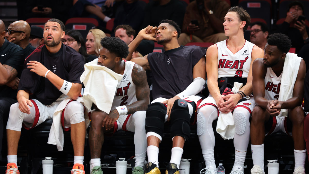 Miami Heat guard Klay Thompson (11), guard Davion Mitchell (2), forward Giannis Antetokounmpo (7), guard Pelle Larsson (9) and forward Andrew Wiggins (22) look on from the bench against the Minnesota Timberwolves during the fourth quarter at Kaseya Center.