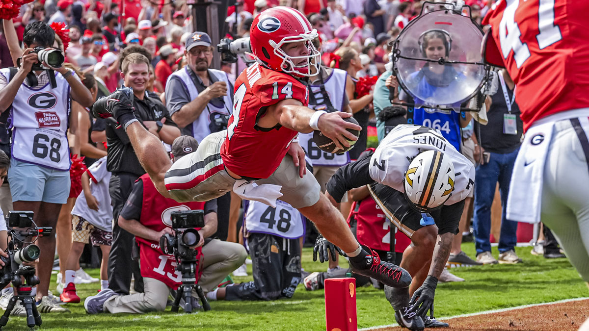 Georgia Bulldogs quarterback Gunner Stockton (14) tries to score against the Vanderbilt Commodores at Sanford Stadium.