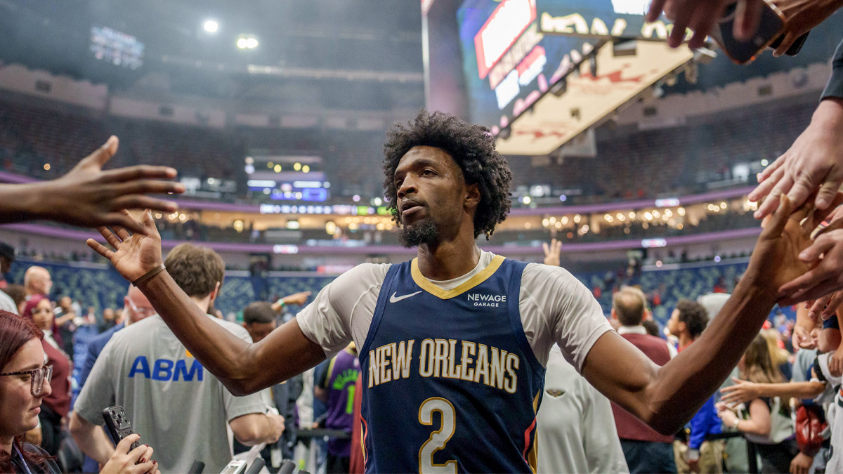 New Orleans Pelicans forward Herbert Jones (2) celebrates with fans after a game against the Sacramento Kings at Smoothie King Center.