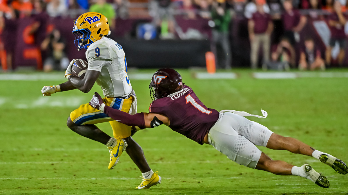 Pittsburgh Panthers running back Ja'kyrian Turner (9) runs the ball as Virginia Tech Hokies safety Tyson Flowers (1) defends during the third quarter at Lane Stadium.