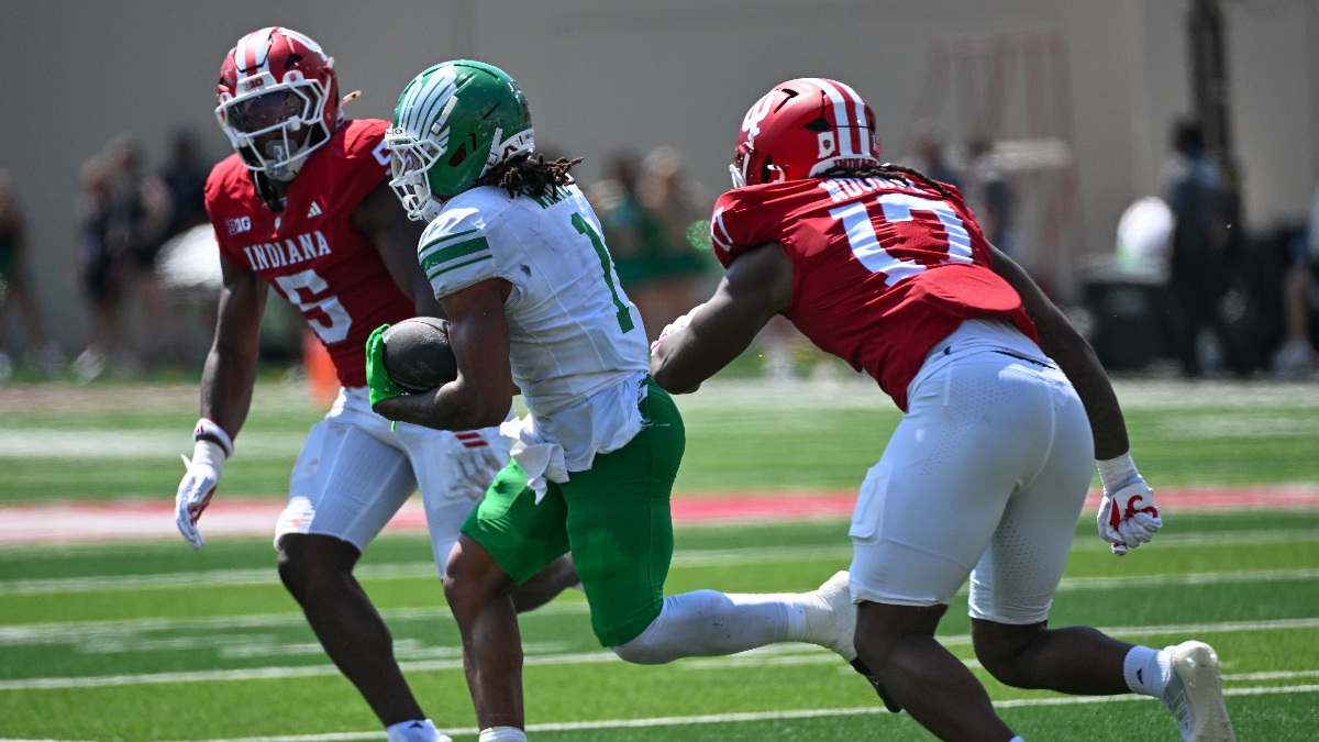 North Texas Mean Green running back Jahiem White (1) carries the ball as Indiana Hoosiers linebacker Rolijah Hardy (5) and defensive lineman Daniel Ndukwe (17) defend during the second quarter at Merchants Bank Field at Memorial Stadium.