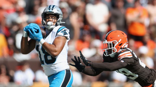 Carolina Panthers wide receiver Jalen Coker (18) makes a catch defended by Cleveland Browns cornerback Mekhi Blackmon (29) during the second quarter at Huntington Bank Field.
