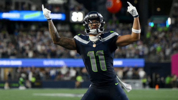 Seattle Seahawks wide receiver Jaxon Smith-Njigba (11) celebrates after scoring a touchdown against the New England Patriots during the fourth quarter at Lumen Field.