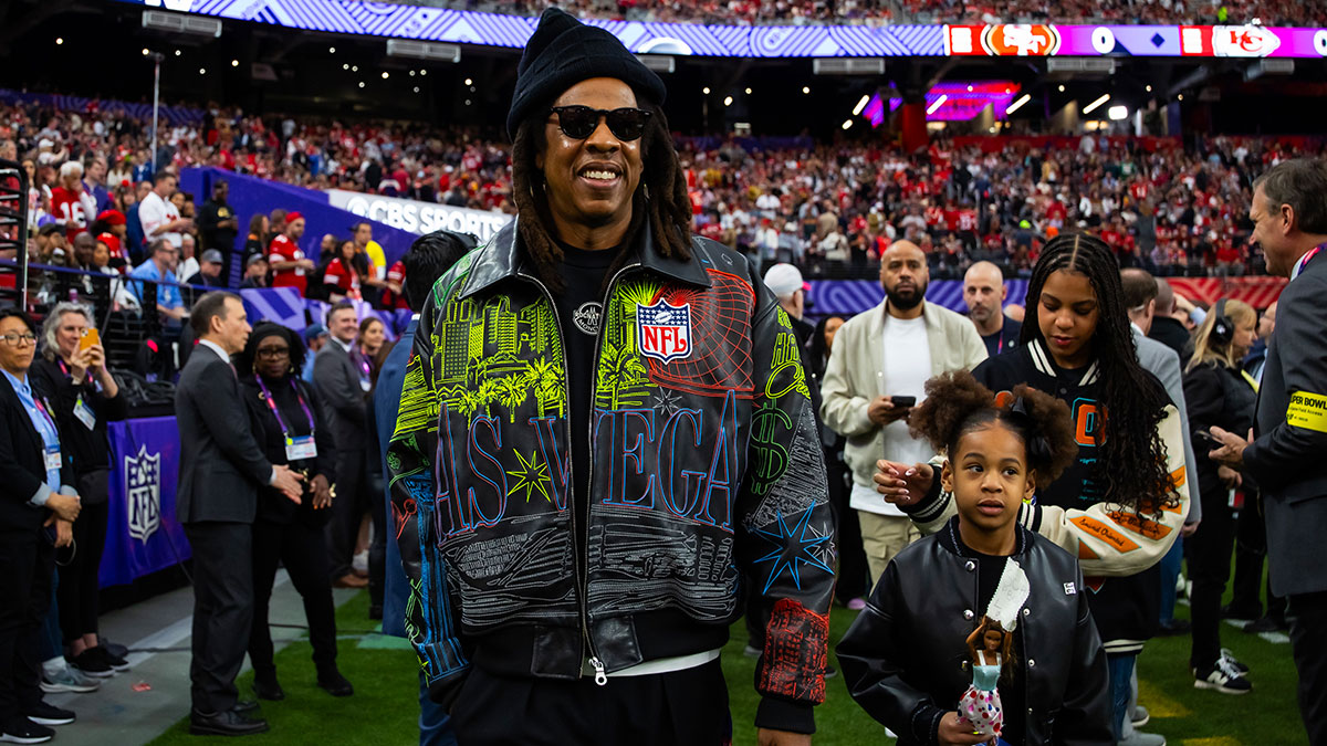 Recording artist Jay-Z walks on the field with daughter Rumi Carter before Super Bowl LVIII between the San Francisco 49ers and the Kansas City Chiefs at Allegiant Stadium. Mandatory Credit: Mark J. Rebilas-USA TODAY Sports