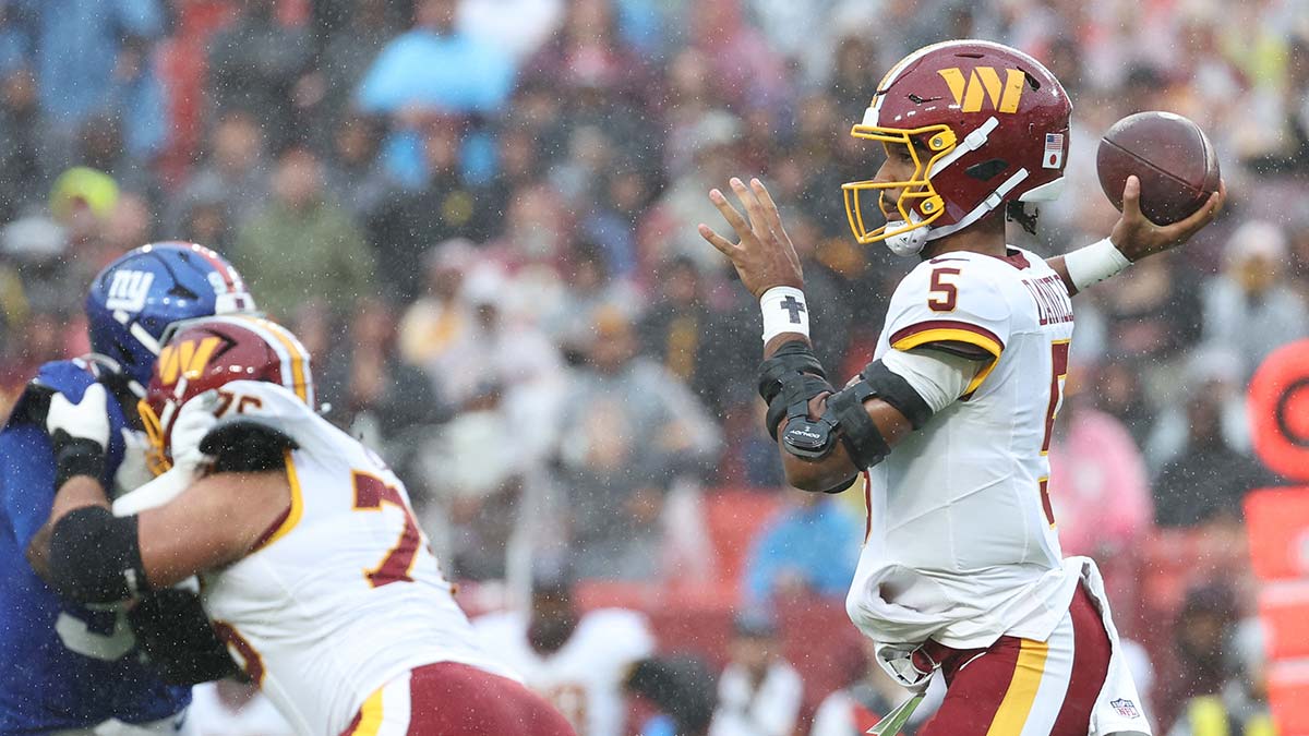 Oct 11, 2026; Landover, Maryland, USA; Washington Commanders quarterback Jayden Daniels (5) looks to pass during the first quarter against the New York Giants at Northwest Stadium.