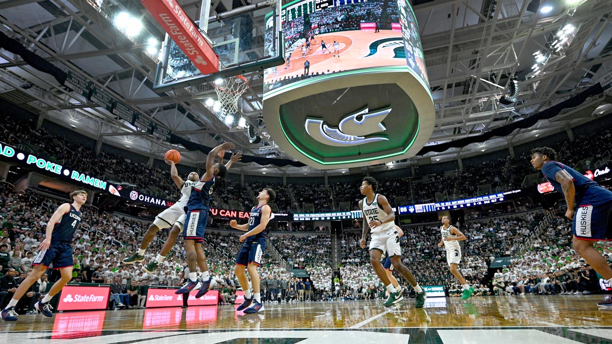Michigan State Spartans guard Jeremy Fears Jr. (1) drives in for a shot against UConn Huskies guard Silas Demary Jr. (5) during the second half at Breslin Center.