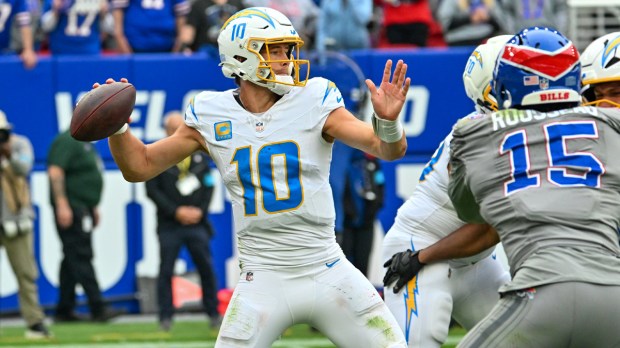 Los Angeles Chargers quarterback Justin Herbert (10) throws in the second half against the Buffalo Bills at New Highmark Stadium.