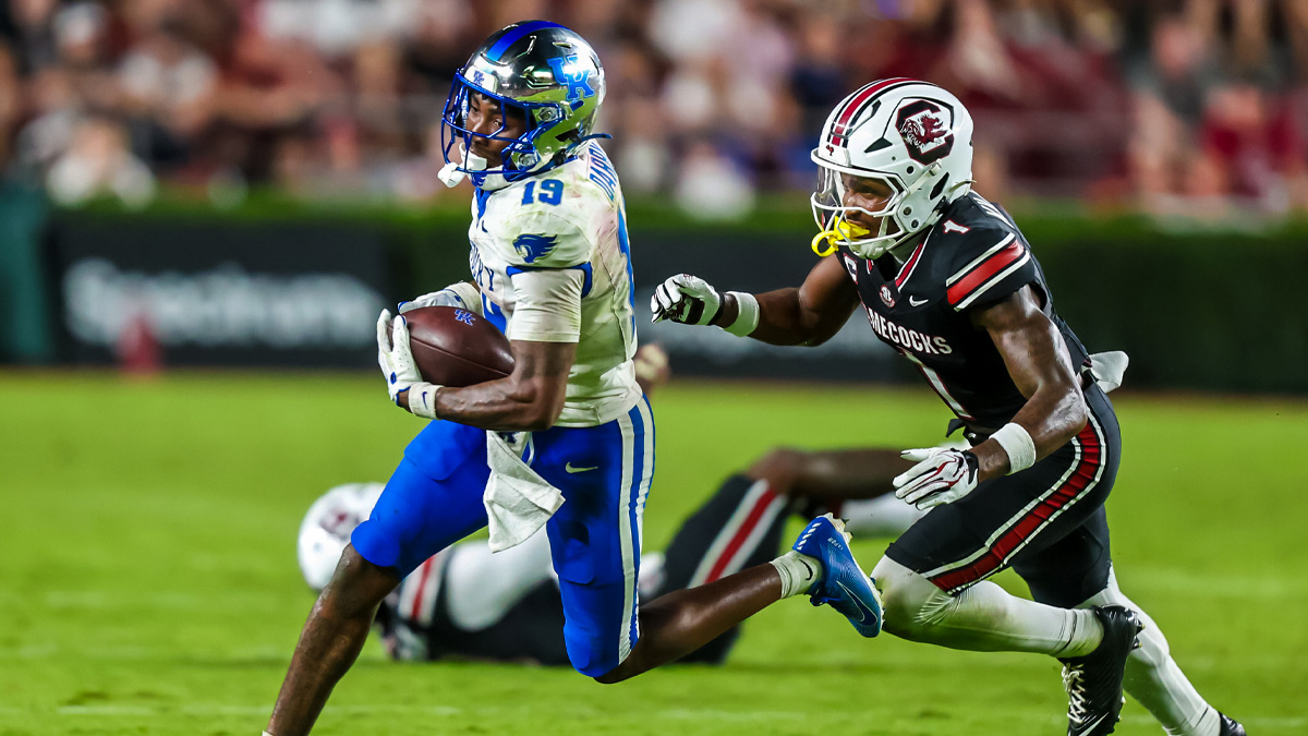Kentucky Wildcats wide receiver Kenny Darby (19) rushes away from South Carolina Gamecocks defensive back Gerald Kilgore (1) in the second half at Williams-Brice Stadium.