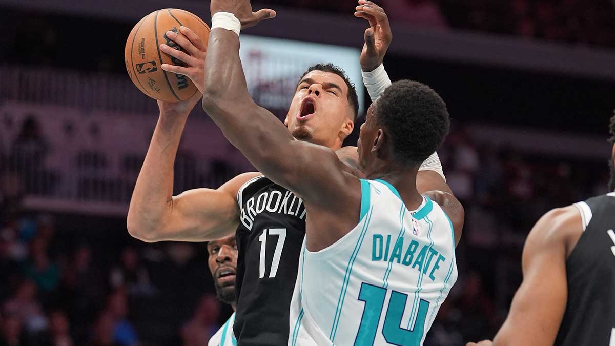 Oct 6, 2026; Charlotte, North Carolina, USA; Brooklyn Nets forward Michael Porter Jr. (17) reacts to contact with Charlotte Hornets forward Moussa Diabate (14) during the second quarter at Spectrum Center. Mandatory Credit: Jim Dedmon-Imagn Images