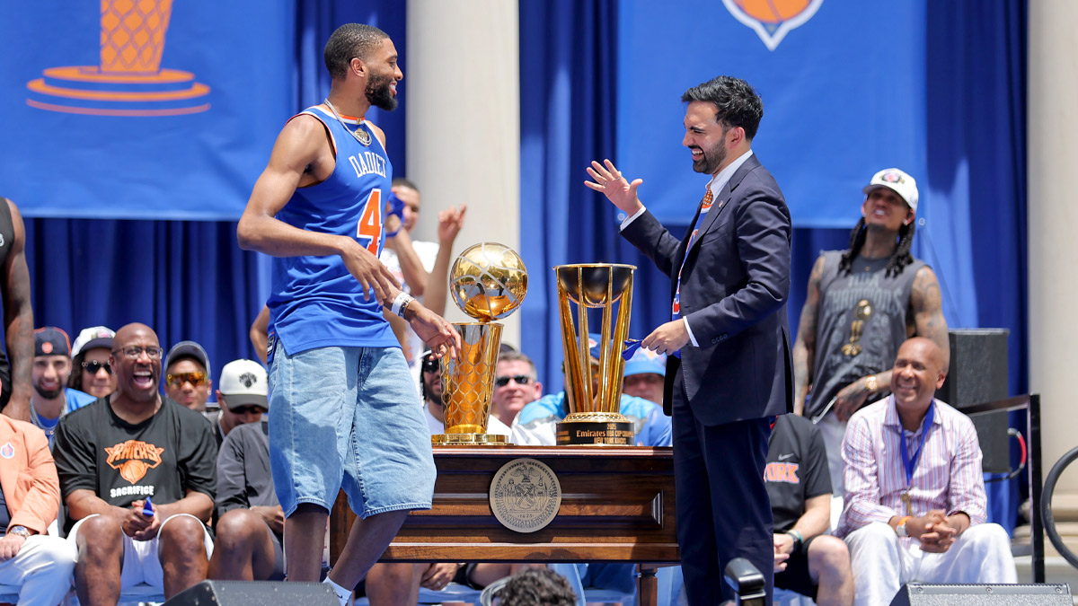 New York Knicks guard Mikal Bridges greets mayor Zohran Mamdani before receiving a key to the city during a ceremony at New York City Hall after the championship parade.