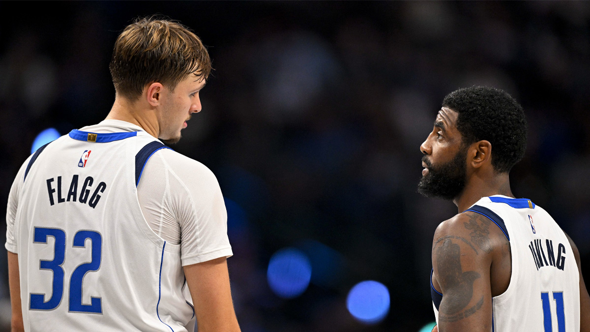 Dallas Mavericks guard Kyrie Irving (11) talks with forward Cooper Flagg (32) during the second half against the Atlanta Hawks at American Airlines Center.