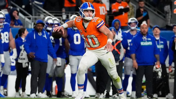 Denver Broncos quarterback Bo Nix (10) looks to throw in the second half against the Seattle Seahawks at Empower Field at Mile High