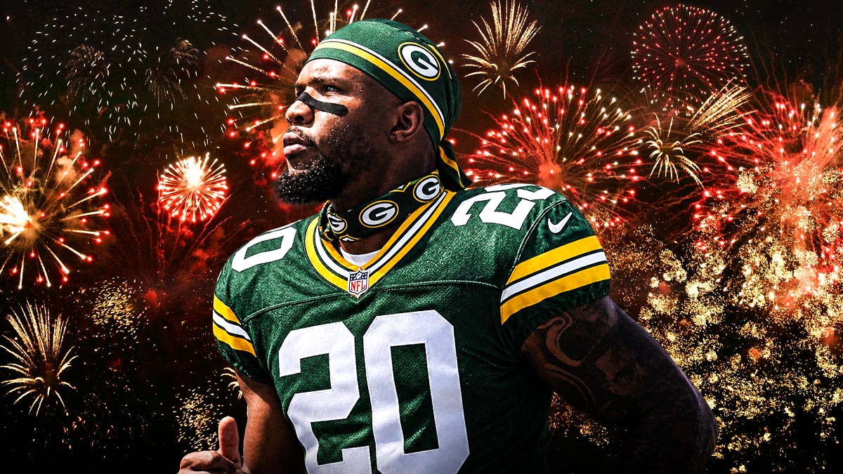 Tony Pollard in an Packers uniform Fireworks in the background