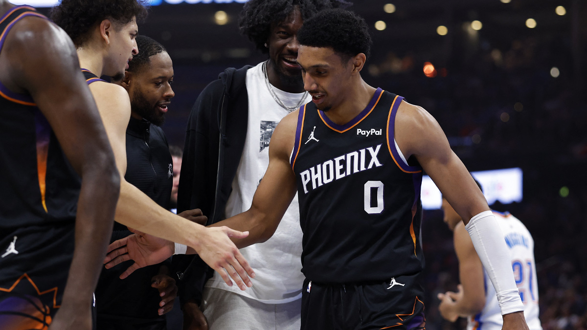 Phoenix Suns forward Ryan Dunn (0) high fives his team after a play against the Oklahoma City Thunder during the first quarter at Paycom Center.