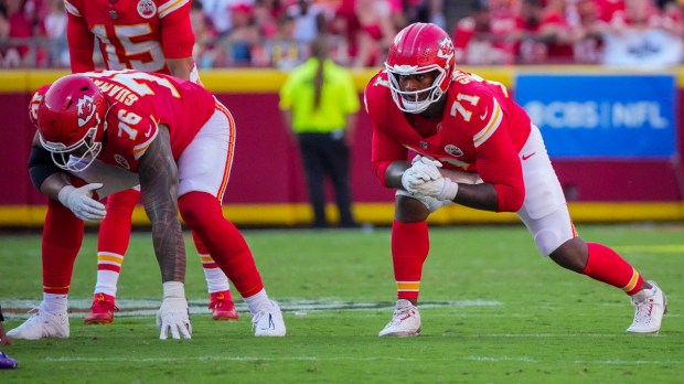 Kansas City Chiefs offensive tackle Kingsley Suamataia (76) and offensive tackle Josh Simmons (71) at the line of scrimmage against the Baltimore Ravens during the game at GEHA Field at Arrowhead Stadium.