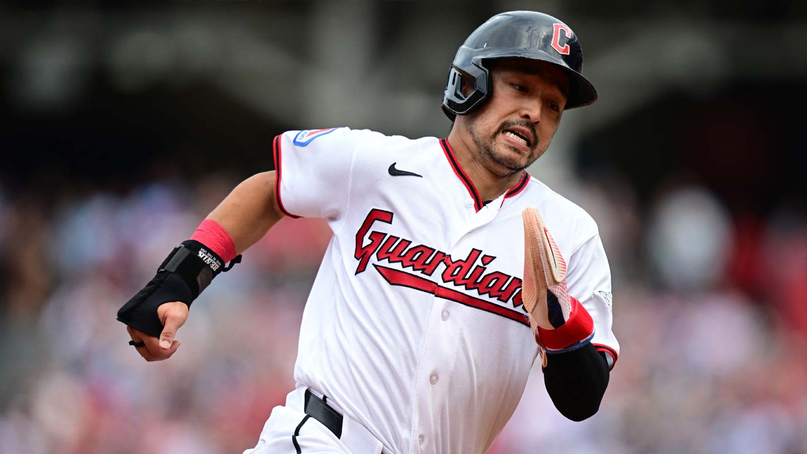 Cleveland Guardians left fielder Steven Kwan (38) runs home to score a run on a two-RBI single by right fielder Jo Adell (7) during the third inning against the Chicago White Sox at Progressive Field.