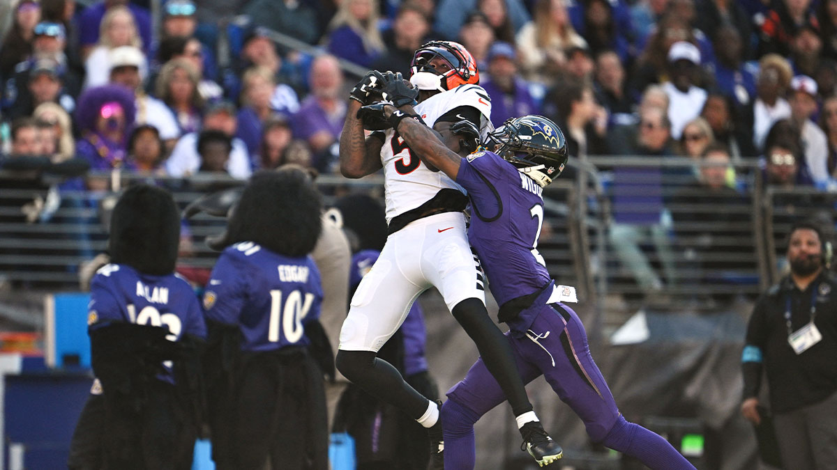 Oct 25, 2026; Baltimore, Maryland, USA; Cincinnati Bengals wide receiver Tee Higgins (5) makes a catch defended by Baltimore Ravens cornerback Nate Wiggins (2) during the second half at M&T Bank Stadium.