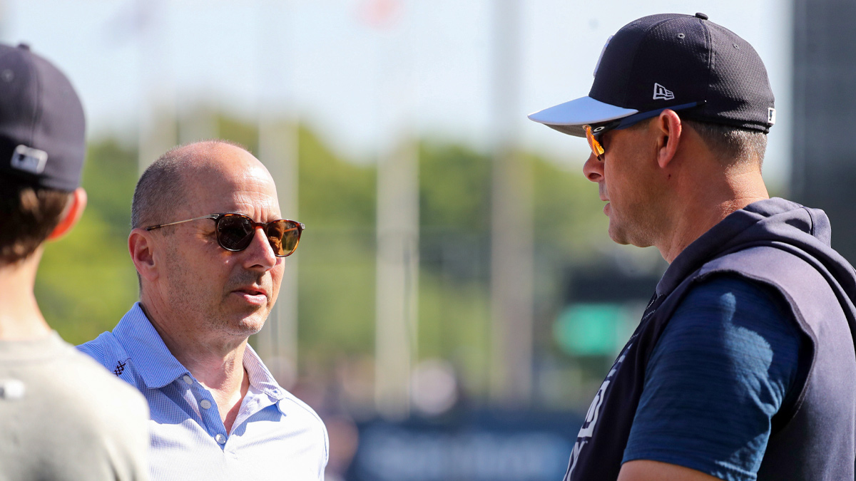 New York Yankees general manager Brian Cashman and manager Aaron Boone (17) talk prior to the game against the Boston Red Sox at George M. Steinbrenner Field.