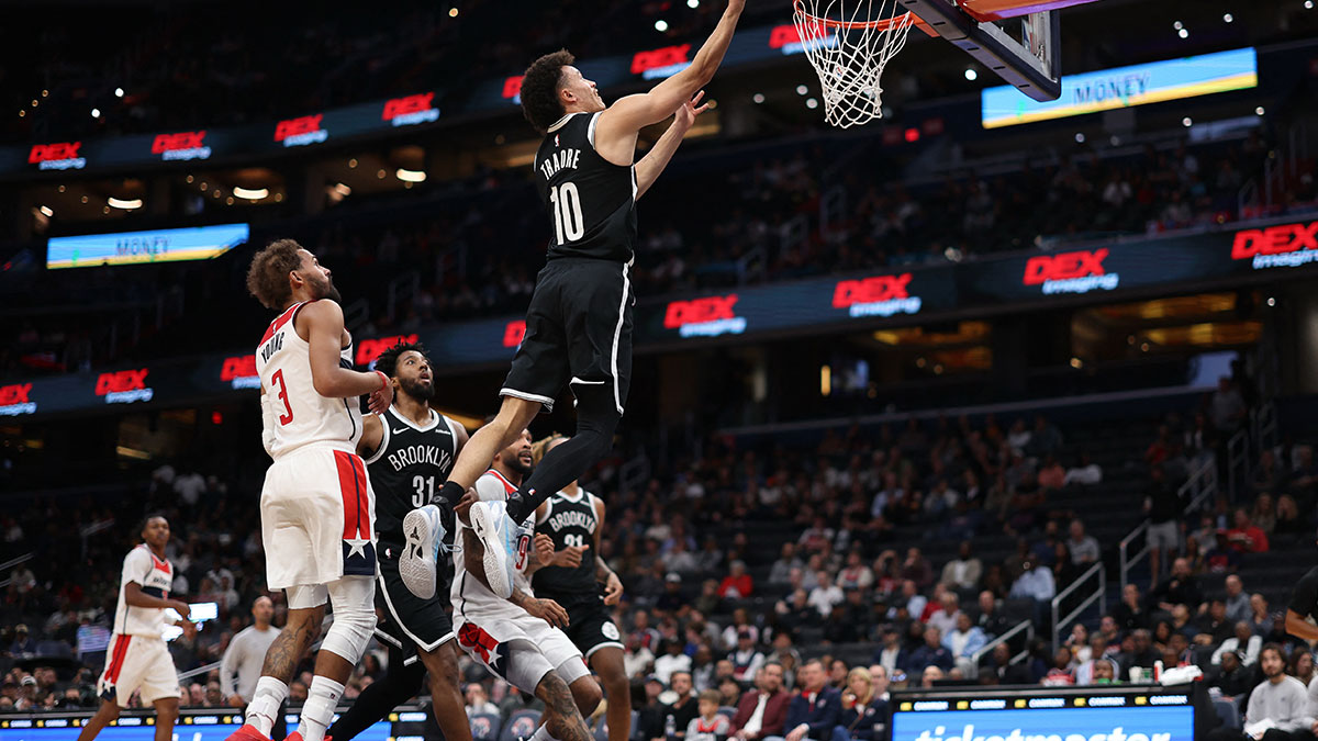 Brooklyn Nets guard Nolan Traore (10) shoots the ball as Washington Wizards guard Trae Young (3) looks on in the first half at Capital One Arena.