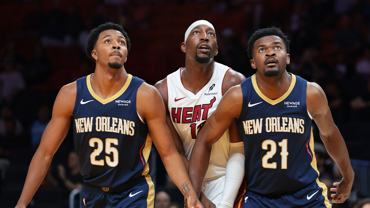 New Orleans Pelicans forward Trey Murphy III (25) and center Yves Missi (21) defend against Miami Heat center Bam Adebayo (13) during the first quarter at Kaseya Center.