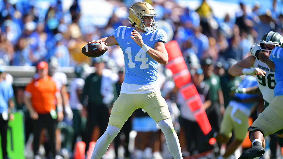 UCLA Bruins quarterback Ty Dieffenbach (14) looks to throw against the Michigan State Spartans during the first quarter at Rose Bowl.